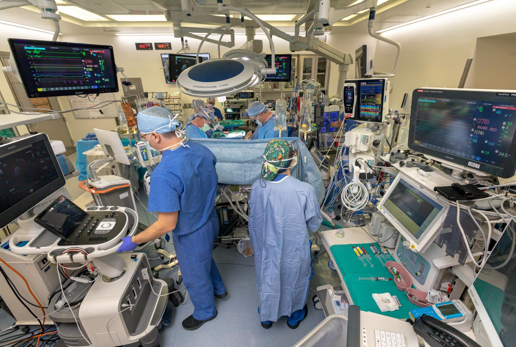 Dr. Igor Feinstein orchestrates dozens of data streams in real time—heart rate, oxygen levels, brain activity, and more—during Debbie Stiles’ six-hour surgery, fine-tuning her the body’s response like a conductor with no room for error.