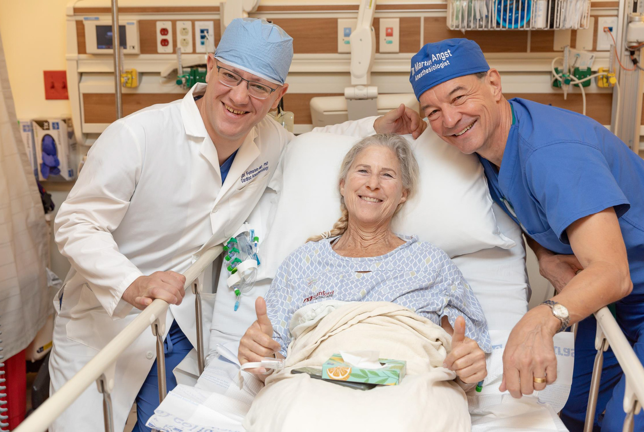From left to right: Dr. Igor Feinstein, Debbie Stiles, and Dr. Martin Angst gather before surgery, beginning their journey of care and discovery.
