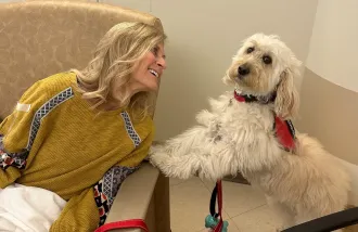 Lyn Castellano receives infusions of Eisai and Biogen's Alzheimer's drug Leqembi, alongside her service dog Jazmin at the Missouri Baptist Medical Center Infusion Center in St. Louis, Missouri, U.S. October 30, 2023. Joe Castellano/Handout via REUTERS