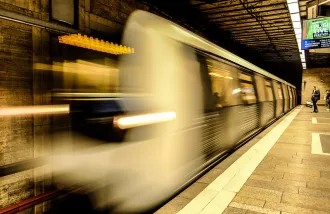 A subway train in motion.